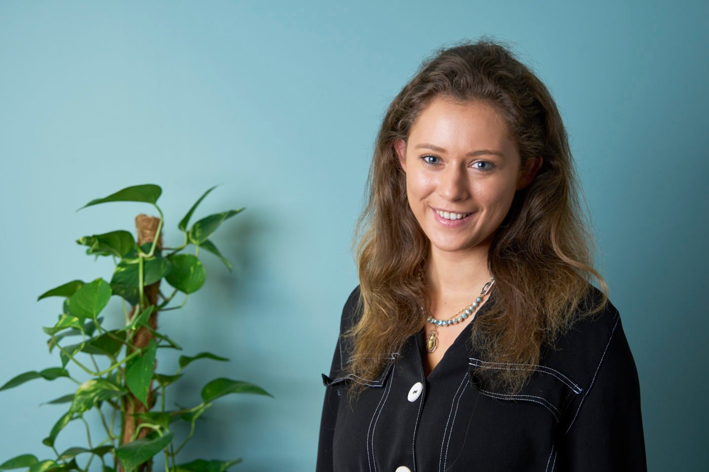 Studio-style headshot of a Pebbles team member