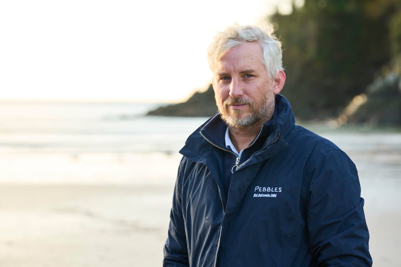 Portrait of a Pebbles team member on the beach